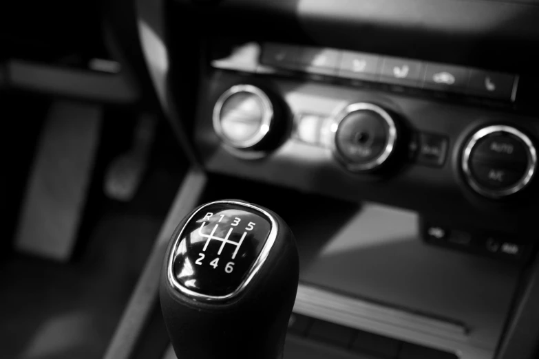 a close up of a gear stick in a car, by Karl Buesgen, square, bw, digital media, server