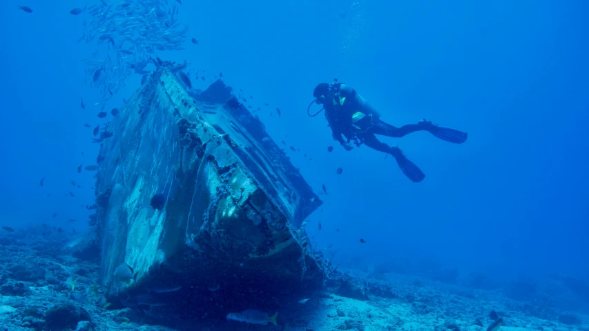 a person swimming next to a ship in the ocean, shipwrecks, scuba diving, avatar image