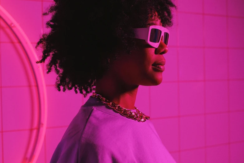 a woman with glasses standing in front of a mirror, trending on pexels, afrofuturism, bright pink purple lights, woman in streetwear, cyber necklace, vhs style