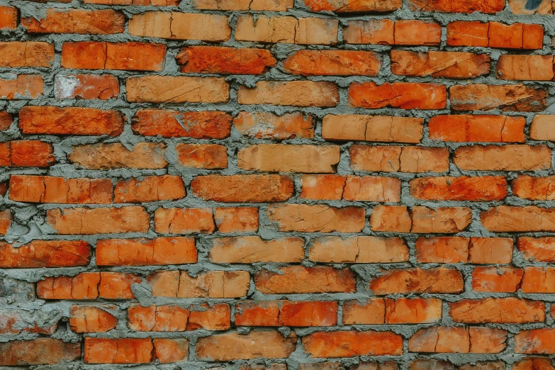 a fire hydrant sitting in front of a brick wall, an album cover, by Adam Marczyński, hyperrealism, orange, tileable, background image, brick wall texture