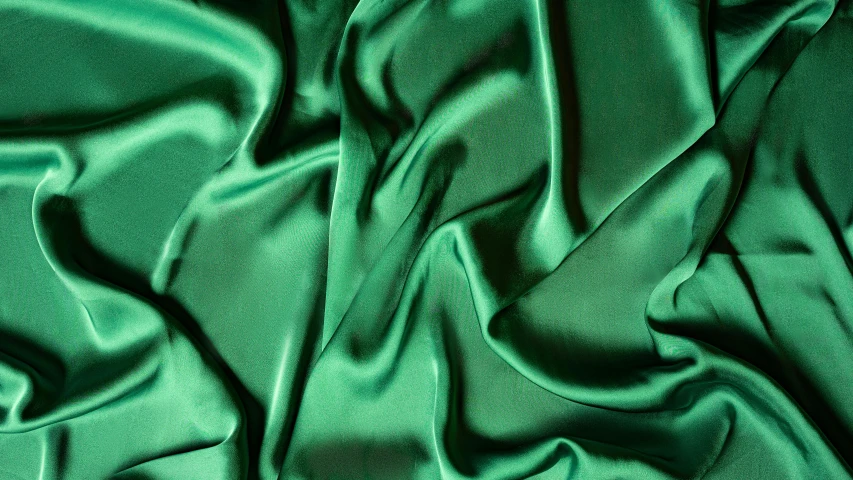 a close up of a green satin fabric, inspired by Art Green, brilliantly coloured, jade green, highly polished, eucalyptus