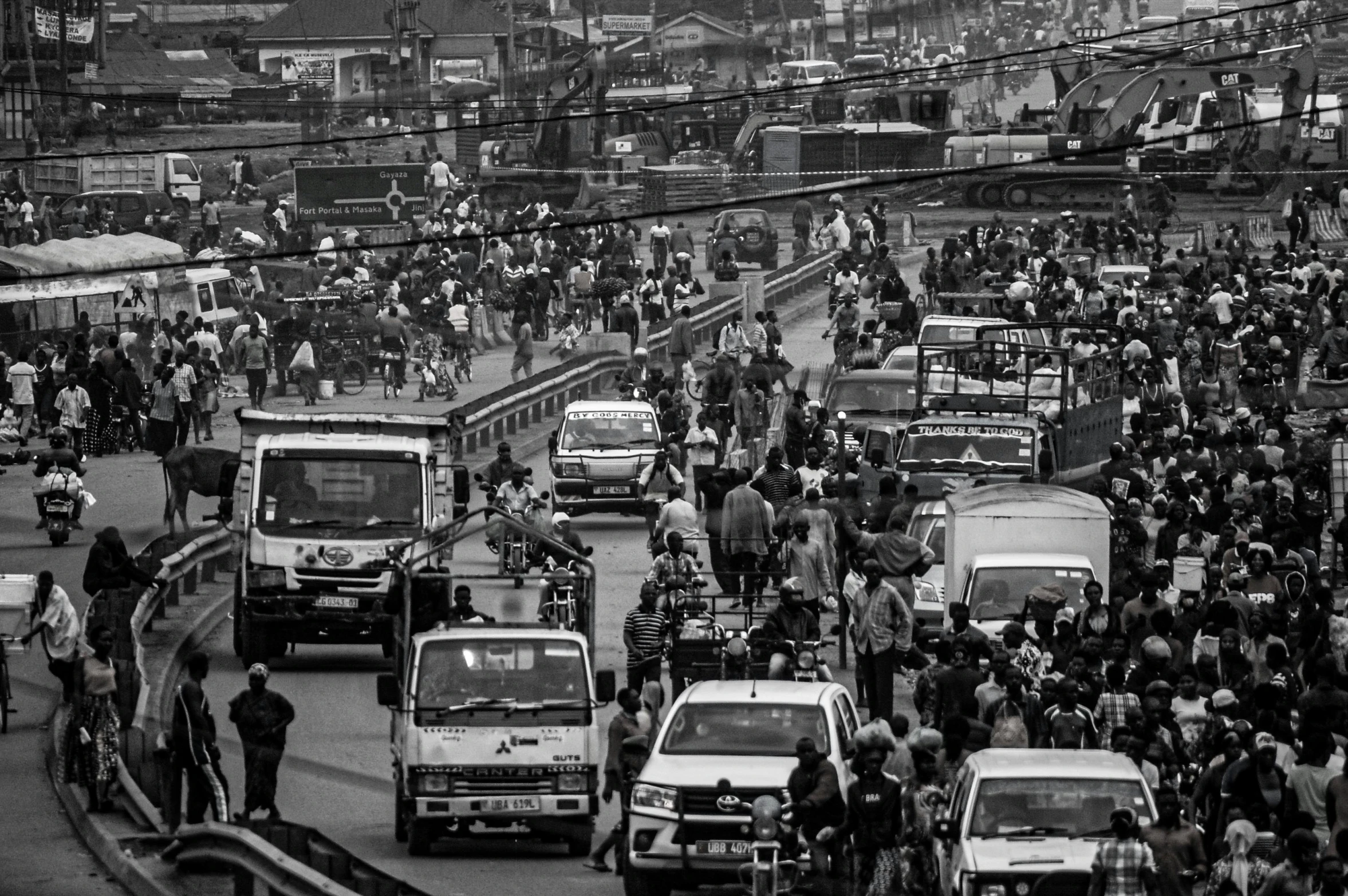 a black and white photo of a busy city street, happening, dhaka traffic, brown, thumbnail, 8