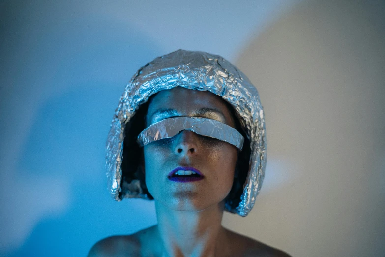 a woman with tin foil covering her eyes, by Julia Pishtar, holography, glowing eyes in helmet, liam brazier, photo shoot, space molly