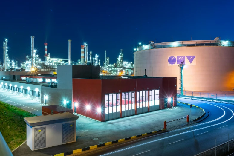 a view of an oil refinery at night, pexels contest winner, bauhaus, ultraviolet and neon colors, overwatch building, cosmoport, seen from outside