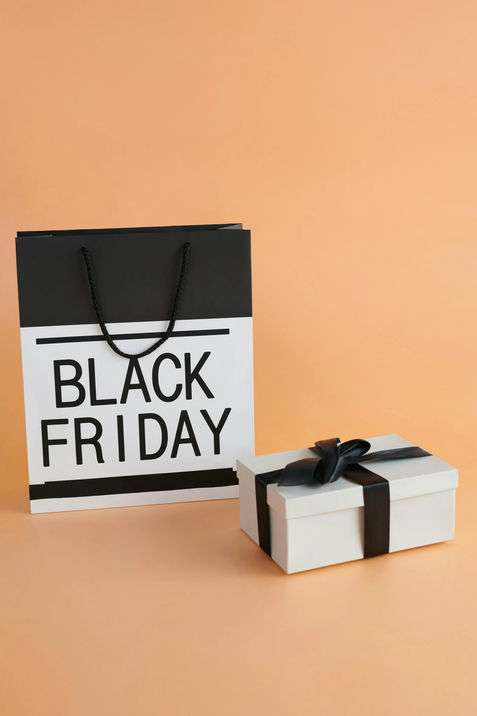 two gift bags with black friday written on them, by Andries Stock, shutterstock, blocktober, album photo, no - text no - logo, burberry