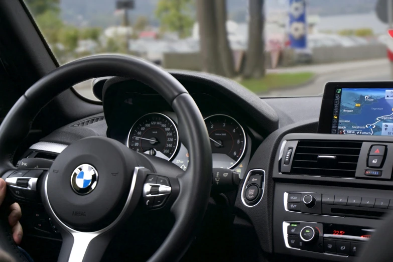 a close up of a person driving a car, bmw, square, high-quality dslr photo”