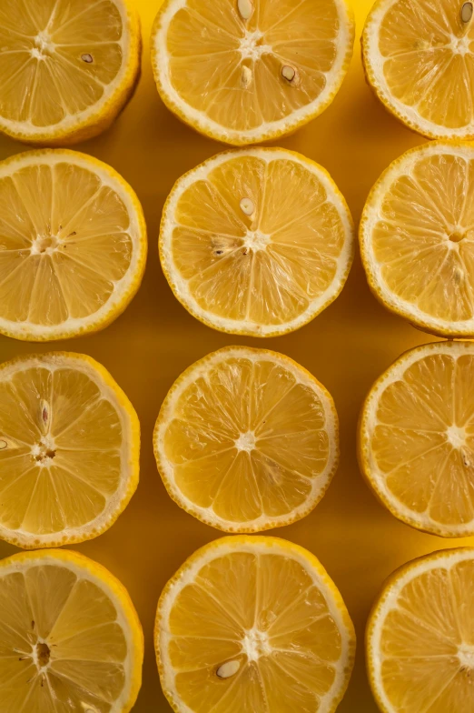 a bunch of lemons sitting on top of each other, zoomed in shots, sustainable materials, 4l, colors: yellow