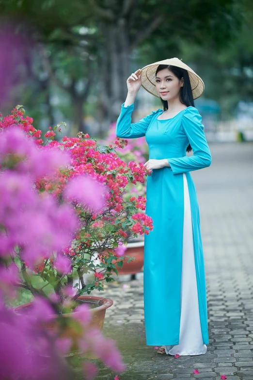 a woman wearing a blue dress and a hat, a picture, inspired by Cui Bai, pixabay contest winner, ao dai, white and teal garment, 15081959 21121991 01012000 4k, full body photogenic shot