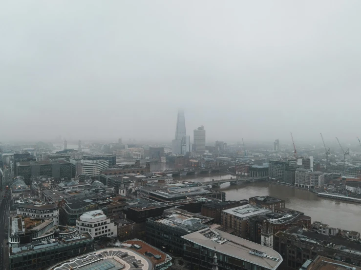 the view of london from the shard of the shard of the shard of the shard of the shard of the shard, an album cover, pexels contest winner, overcast gray skies, foggy photo 8 k, drone footage, grey