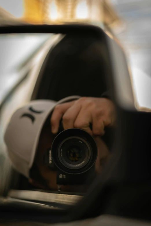 a person taking a picture of themselves in a rear view mirror, a picture, pexels contest winner, sport photography, headshot profile picture, looking down on the camera, ((sharp focus))