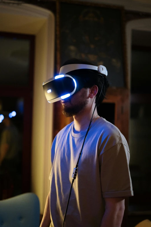 a man wearing a virtual reality headset in a living room, by Ryan Pancoast, happening, with glowing blue lights, rey, slide show, holy grail