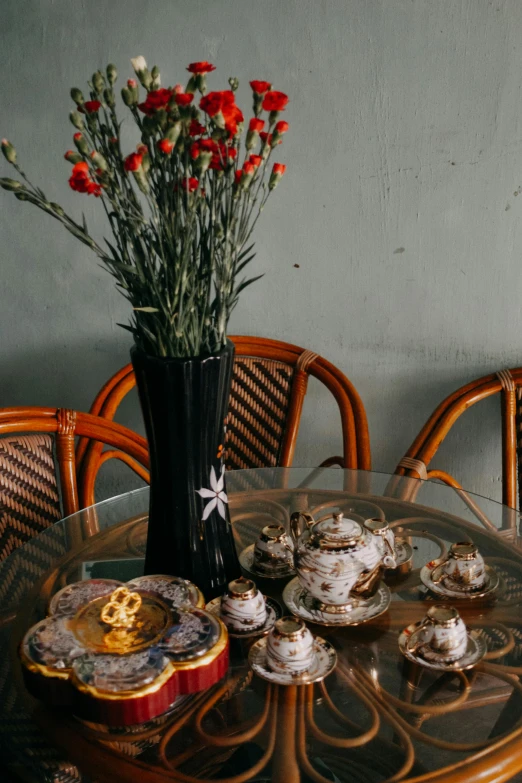 a vase of flowers sitting on top of a table, by Miroslava Sviridova, trending on unsplash, art nouveau, pastries, indonesia, 1 9 2 0 s room, instagram story