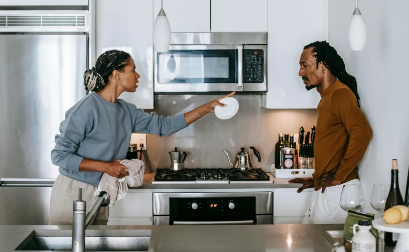 a man and a woman standing in a kitchen, pexels contest winner, happening, arguing, background image, diverse, late morning