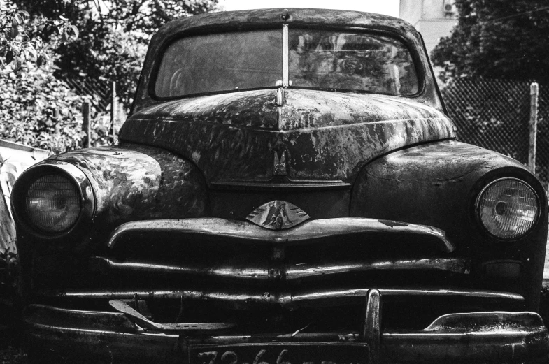 a black and white photo of an old car, by andrei riabovitchev, pexels contest winner, auto-destructive art, mercury, featured, front, preserved historical