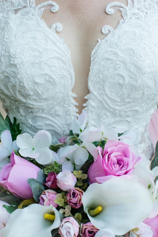 a woman in a wedding dress holding a bouquet of flowers, inspired by Rudolf von Alt, unsplash, romanticism, push-up underwire. intricate, intricate details. front on, white and pink, front closeup