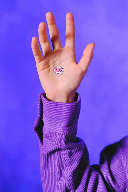 a person holding their hand up in the air, a tattoo, inspired by L. A. Ring, holography, ((purple)), 1999 photograph, the microchip, pop culture