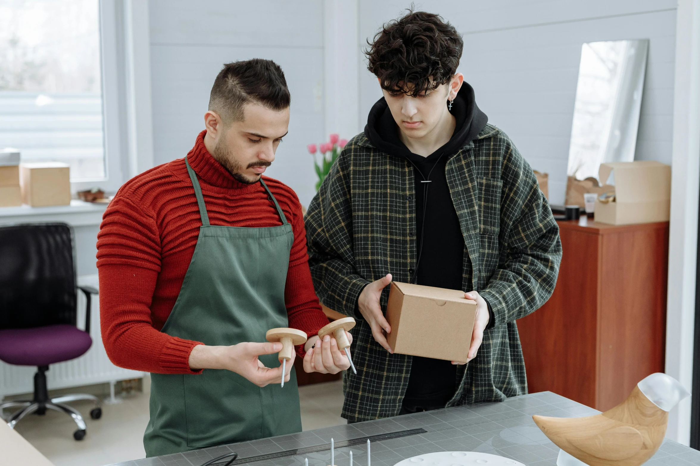 a couple of men standing next to each other in a kitchen, pexels contest winner, arbeitsrat für kunst, delivering parsel box, teen boy, leather apron, thumbnail