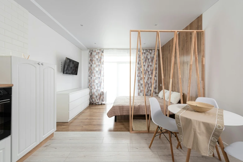 a living room filled with furniture and a flat screen tv, a picture, by Adam Marczyński, unsplash, light and space, white bed, polygonal wooden walls, beige color scheme, ƒ/5.6