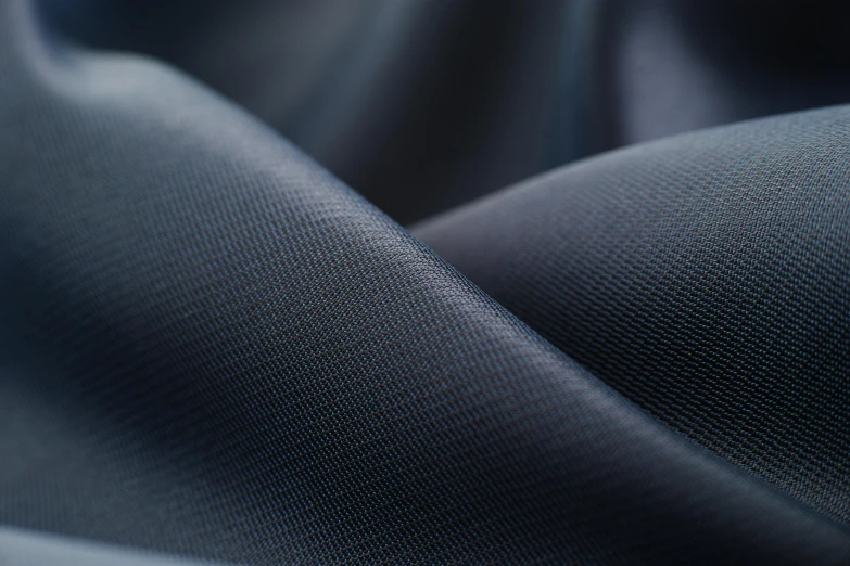 a close up of a dark blue fabric, smooth in 8k, in gunmetal grey, translucent, luxcore render