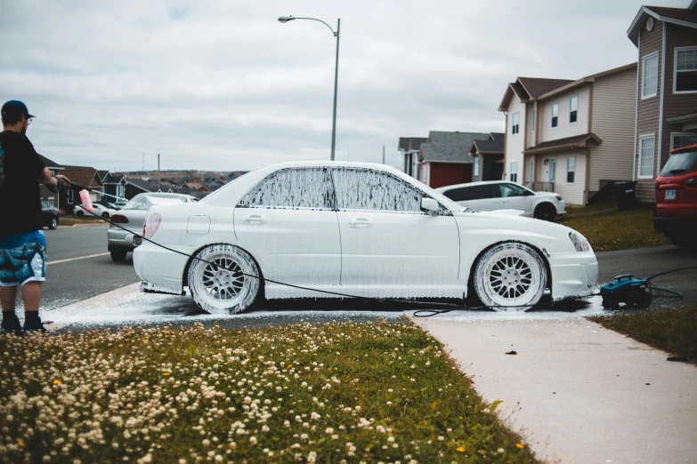 a man washing a white car with a hose, inspired by An Gyeon, pexels contest winner, auto-destructive art, full body shot hyperdetailed, subaru, reddit meme, view from the streets