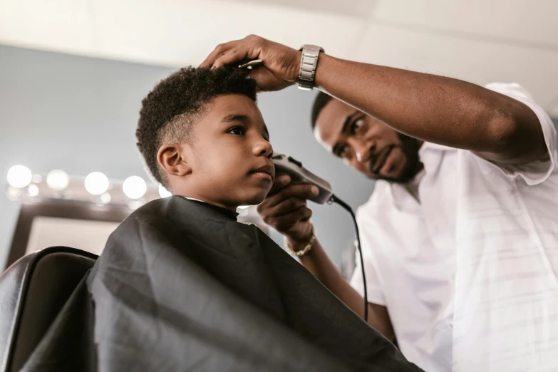 a man cutting a young boy's hair in a barber shop, pexels contest winner, black dynamic hair, thumbnail, ready to model, quiet beauty