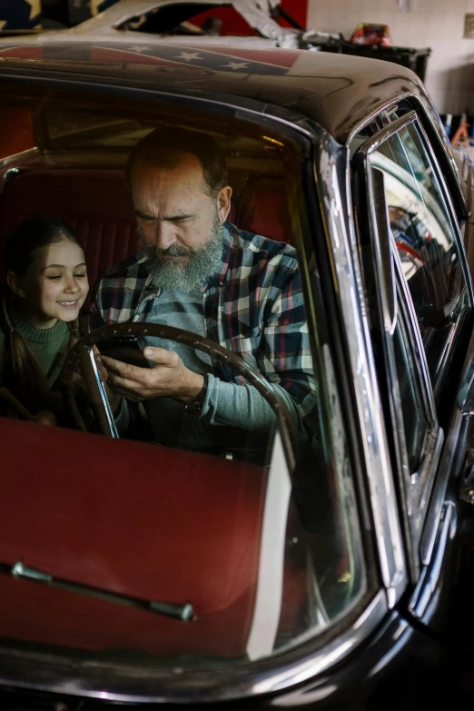 a man and a woman sitting in a car looking at a cell phone, gaspar noe, family friendly, square, gen z