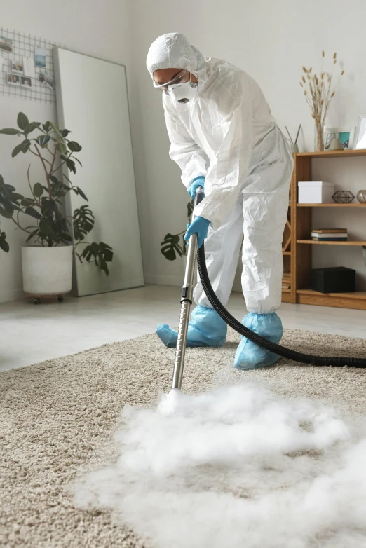 a man in a hazmat suit using a vacuum to clean a carpet, - 8, thumbnail