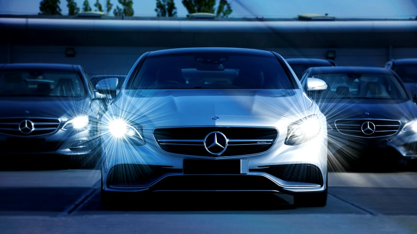 a group of cars parked next to each other in a parking lot, pexels contest winner, photorealism, cyan headlights, mercedez benz, front of car angle, dynamic lighting stars