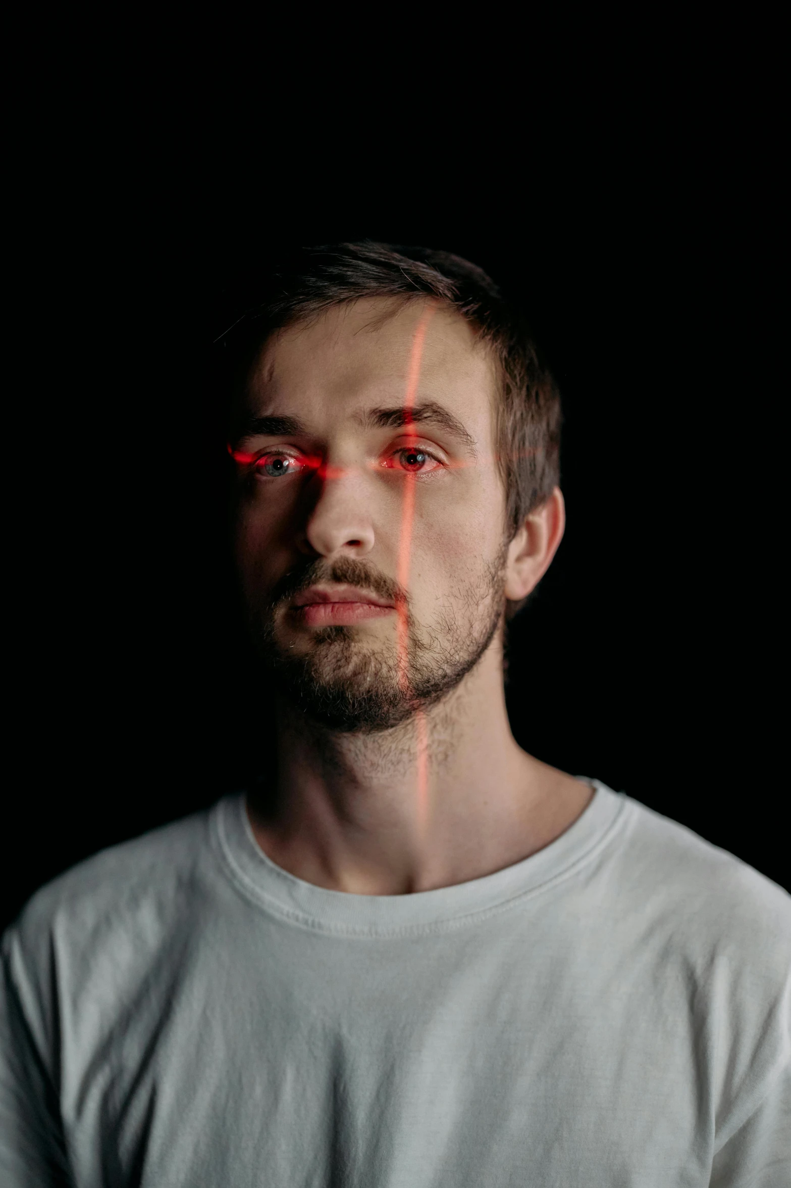 a man with red lines on his face, an album cover, by Adam Marczyński, pexels contest winner, pewdiepie, discord profile picture, laser eyes, thin young male