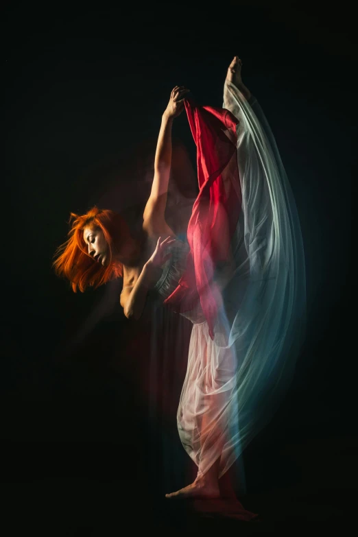 a woman that is standing in the dark, inspired by Maciej Kuciara, art photography, suspended in air, color portrait, dance, woman with red hair