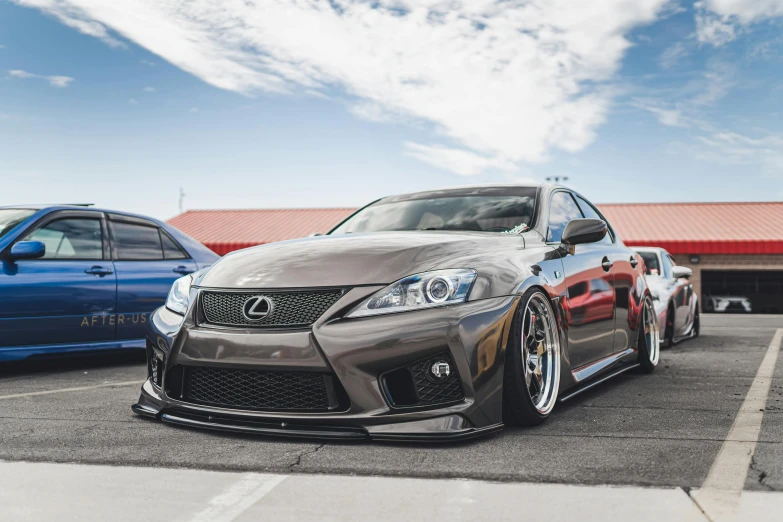 two cars parked next to each other in a parking lot, a picture, by Drew Tucker, pexels contest winner, wide body, frontal pose, jdm, lane brown