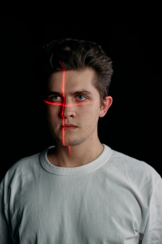 a man with a red cross on his face, an album cover, by Adam Marczyński, pexels contest winner, caspar david, lasers shooting out of eyes, headshot profile picture, peter parker