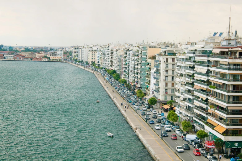 a large body of water surrounded by tall buildings, by Michalis Oikonomou, pexels contest winner, hyperrealism, seaside, theophanes, high resolution print :1 cmyk :1, preserved historical
