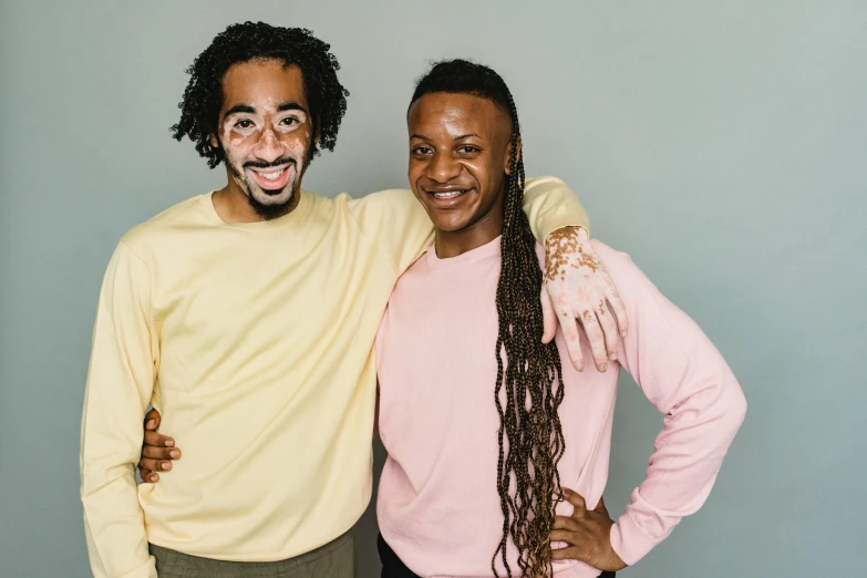 a couple of men standing next to each other, pexels contest winner, antipodeans, dreadlock breed hair, light-brown skin, bowater charlie and brom gerald, coloured