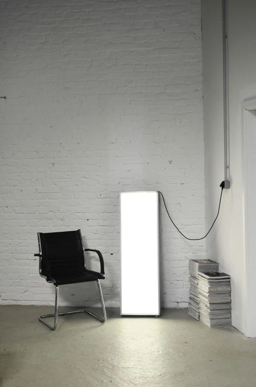 a white refrigerator sitting in a room next to a chair, a poster, inspired by Constantin Hansen, light and space, lamp ( ( ( mirror ) ) ) ), industrial lighting, overview, product lighting