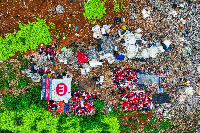 a group of people standing on top of a pile of trash, by Daniel Lieske, unsplash contest winner, environmental art, red and white, wheres waldo, drone photograpghy, 64x64