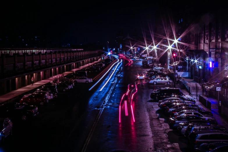 a city street filled with lots of traffic at night, inspired by Elsa Bleda, unsplash contest winner, renaissance, red and blue neon, outside in parking lot, runway, imgur