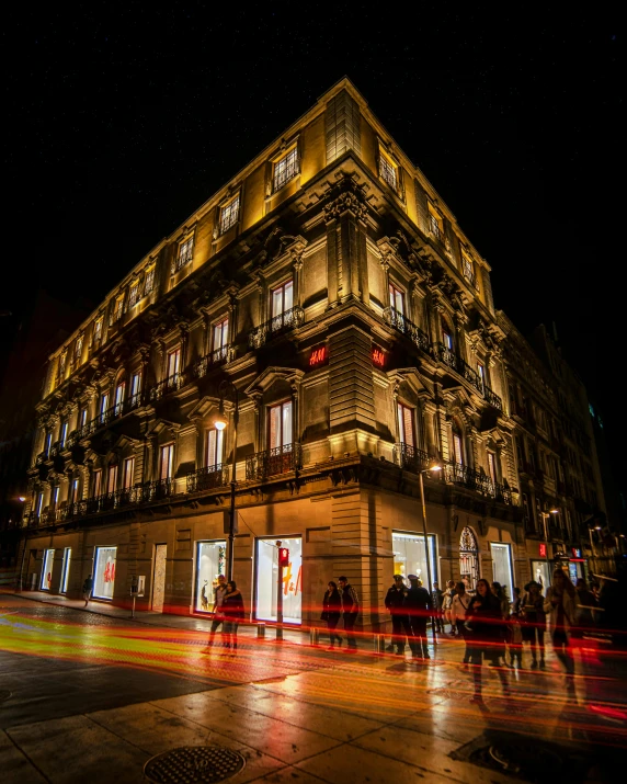 a group of people standing in front of a building at night, by Matteo Pérez, pexels contest winner, renaissance, des boutiques avec des neons, freddy mamani silvestre facade, naples, drag