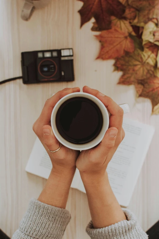 a person holding a cup of coffee in their hands, a polaroid photo, pexels contest winner, autumn tranquility, camera looking down upon, 15081959 21121991 01012000 4k, medium format