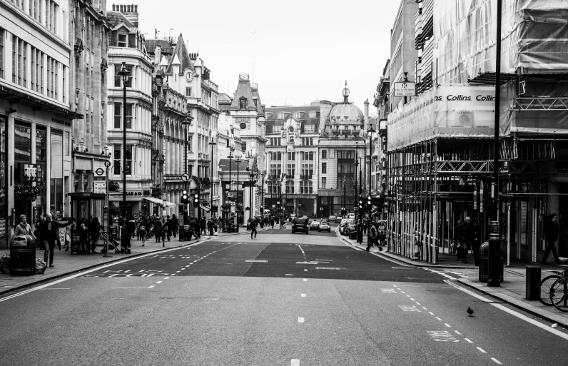 a black and white photo of a city street, by Emma Andijewska, pexels, london architecture, square, street printed poster, diverse