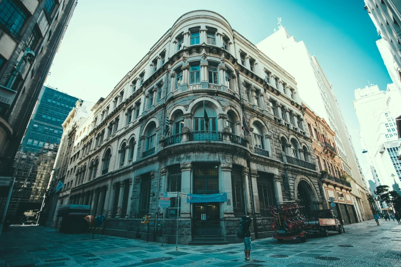 a very tall building sitting in the middle of a city, inspired by Elsa Bleda, pexels contest winner, art nouveau, neoclassical police station, buenos aires, exterior photo, square