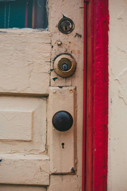 a close up of a door handle on a door, an album cover, by Sven Erixson, unsplash, olive green and venetian red, neighborhood, programming, bells