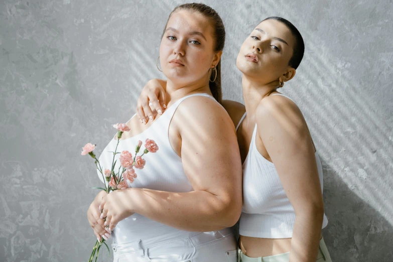 a couple of women standing next to each other, inspired by Wang Duo, trending on pexels, renaissance, alluring plus sized model, fleshy botanical, wearing white clothes, portrait sophie mudd