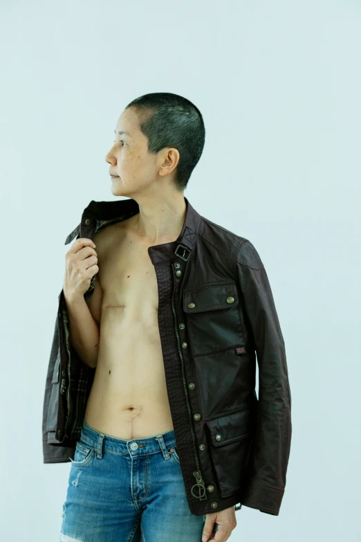 a shirtless man in jeans and a leather jacket, an album cover, inspired by Zhang Kechun, unsplash, an epic non - binary model, mariko mori, brown buzzcut, ((tatsuro yamashita))