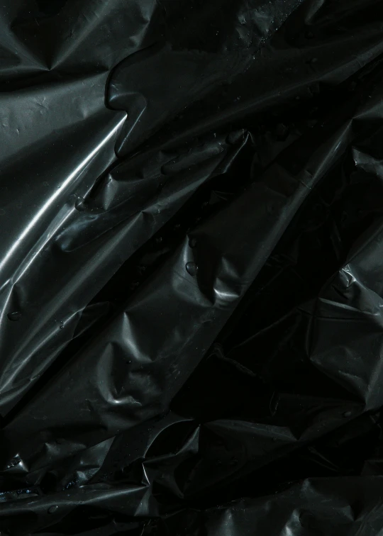 a close up of a black plastic bag, by Patrick Pietropoli, pbr materials, black design, shiny materials, alessio albi