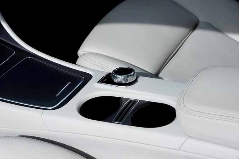 a close up of the center console of a car, inspired by Harry Haenigsen, purism, pearlescent white, thumbnail, with an ashtray on top, sleek round shapes