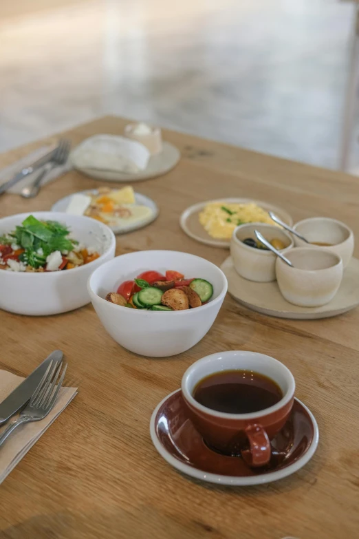 a wooden table topped with bowls of food, inspired by Constantin Hansen, unsplash, dau-al-set, morning detail, cafe, square, white