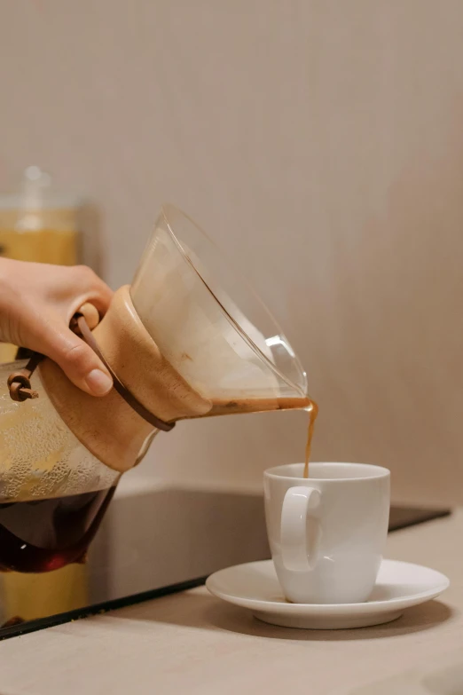 a person pours coffee into a cup, 4l, jakarta, zoomed in, award - winning details