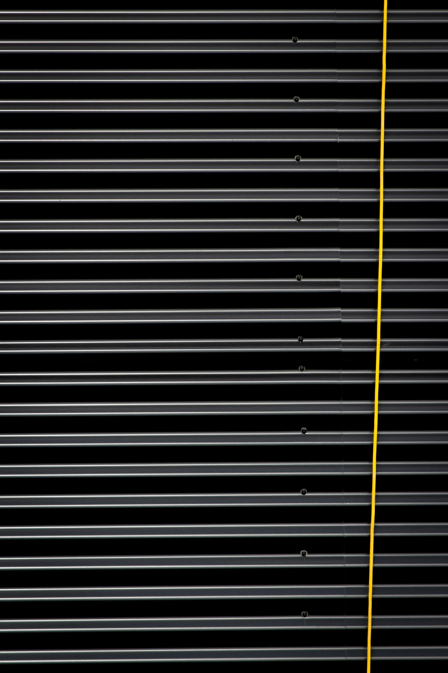 a yellow fire hydrant sitting on top of a sidewalk, inspired by Andreas Gursky, postminimalism, black background pinterest, metal bars, panel of black, shutters