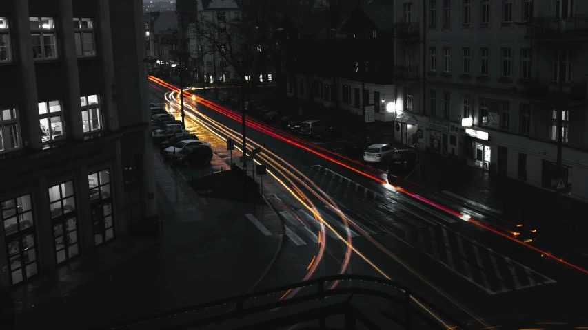 a city street filled with lots of traffic next to tall buildings, by Adam Marczyński, pexels contest winner, light trail, thumbnail, cars, 33mm photo